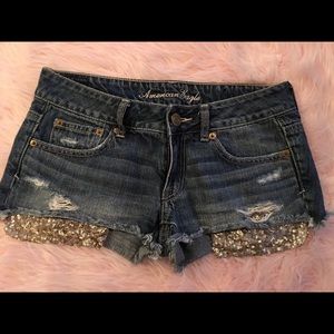 American Eagle distressed jeans with gold pockets